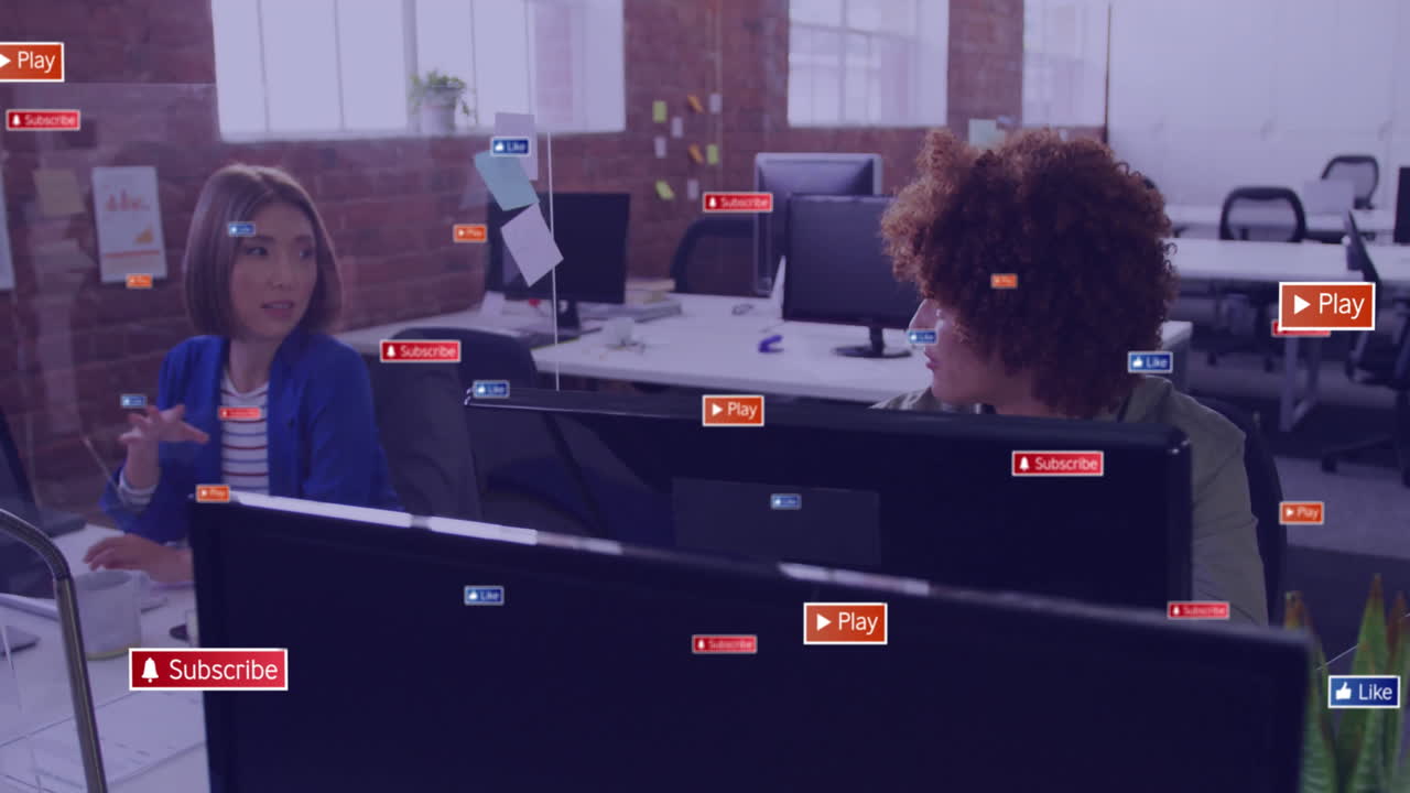 Animation of social media icons with texts over diverse colleagues discussing work in office