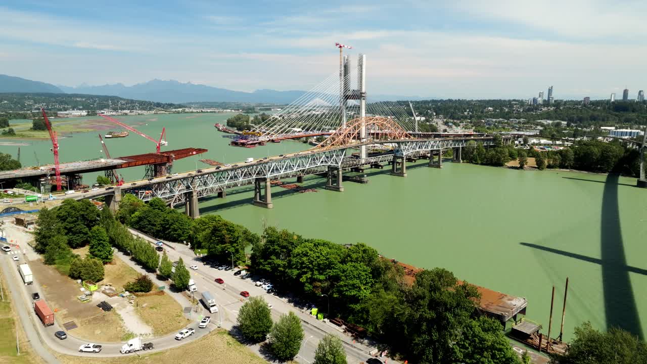 High-rise Condominium Buildings In New Westminster With Patullo Bridge In The Background In BC, Canada. - aerial shot