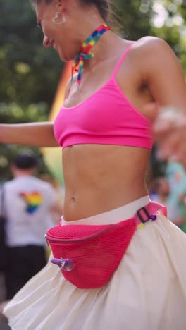 woman dancing at a pride parade