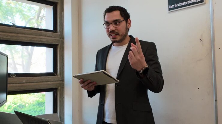 Professor Visualizes Data on Tablet for Class