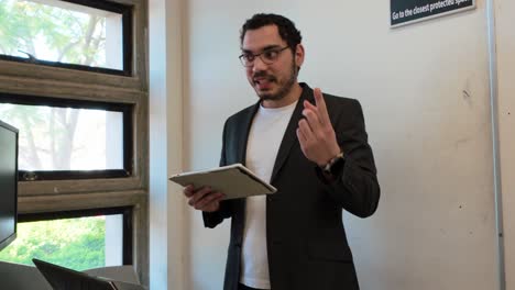 professor visualizes data on tablet for class