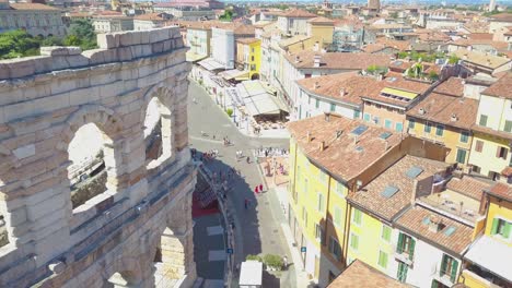 aerial panoramic view of arena di verona, italy. the drone flies near the wall of the arena with arches. a view of the arena and the city opens. 4k vieo.