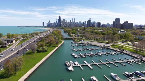 chicago usa, revealing drone shot of downtown buildings from diversey harbor marina, lincoln park and lake shore drive