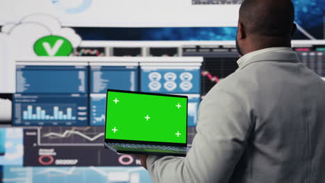 african american specialist looks at laptop with copy space for analysis