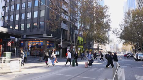 people crossing a street in melbourne, australia