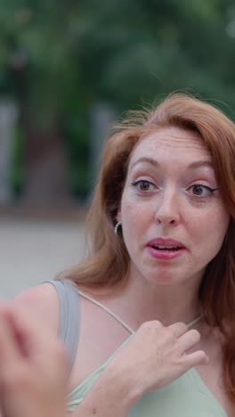 portraits of a redhead woman: clear and obscured views