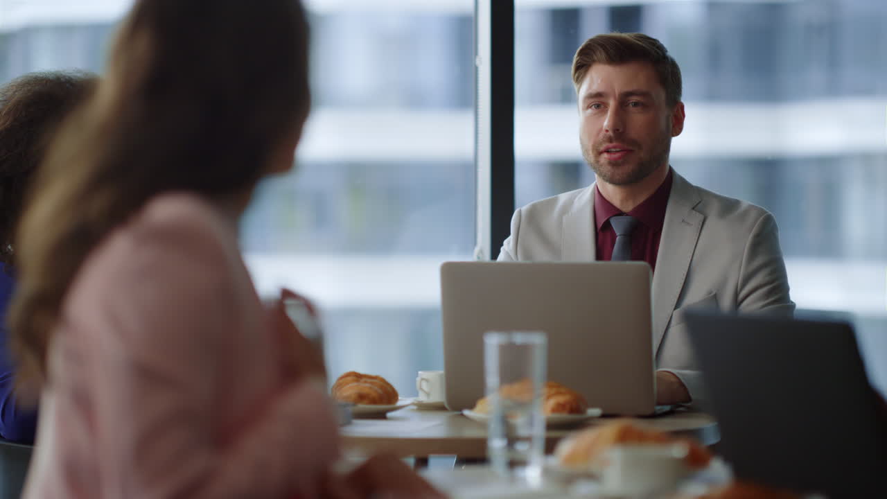 Two colleagues talking in workplace