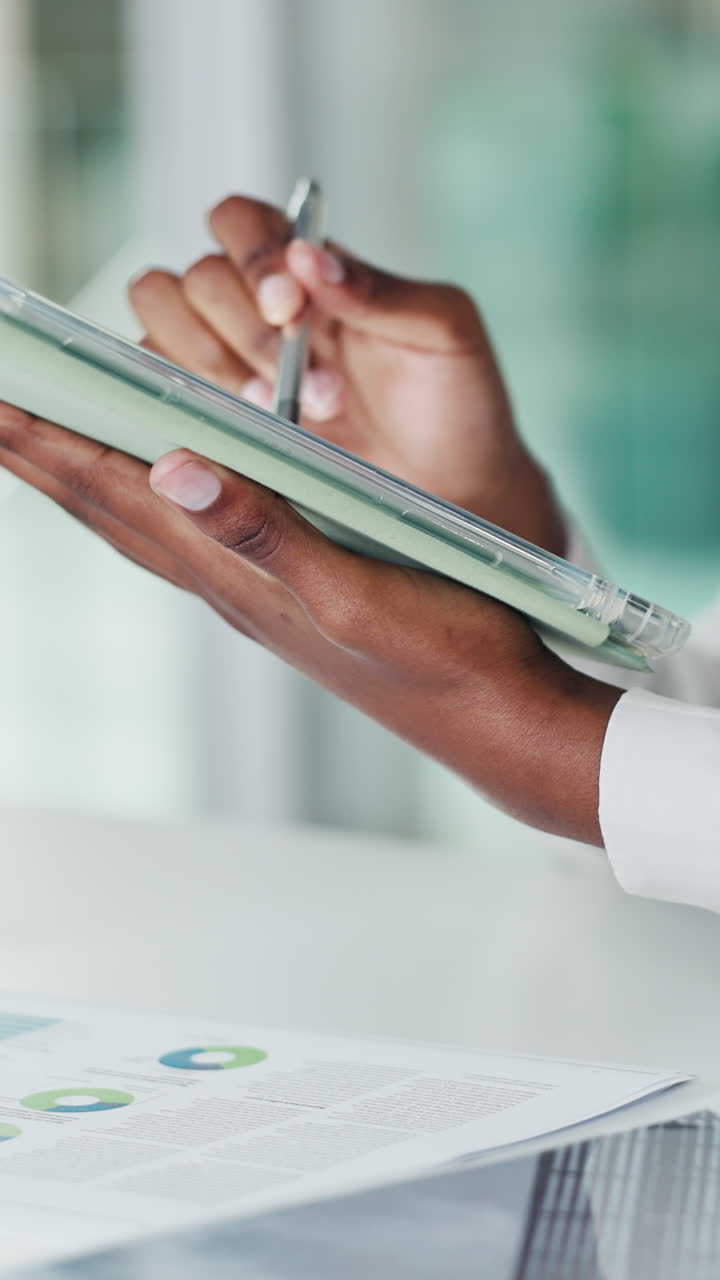 Close-up of Hands Using Stylus on Digital Tablet for Business Analysis