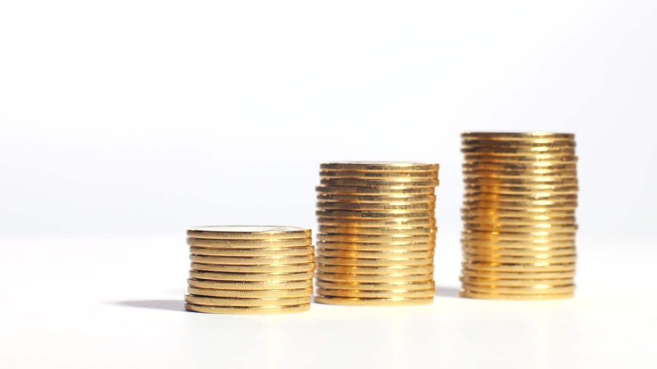 Three stacks of coins in shape of ladder