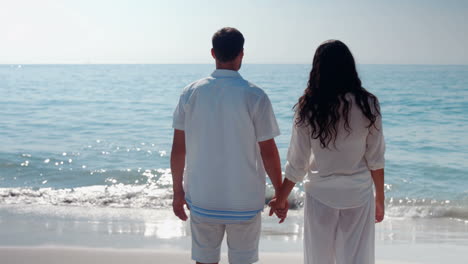 wear view of couple looking at the sea