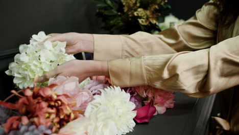 woman hands touching flowers