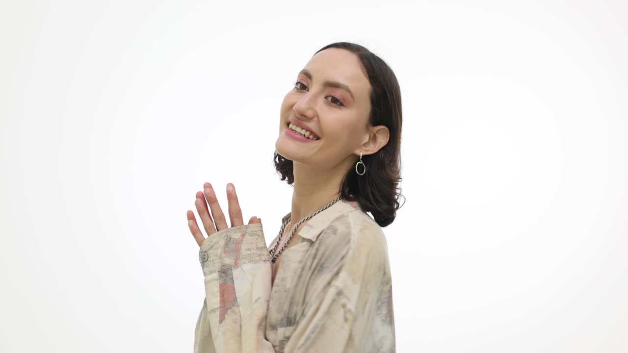 Happy Young Woman Smiling, Talking, and Clapping on White Background