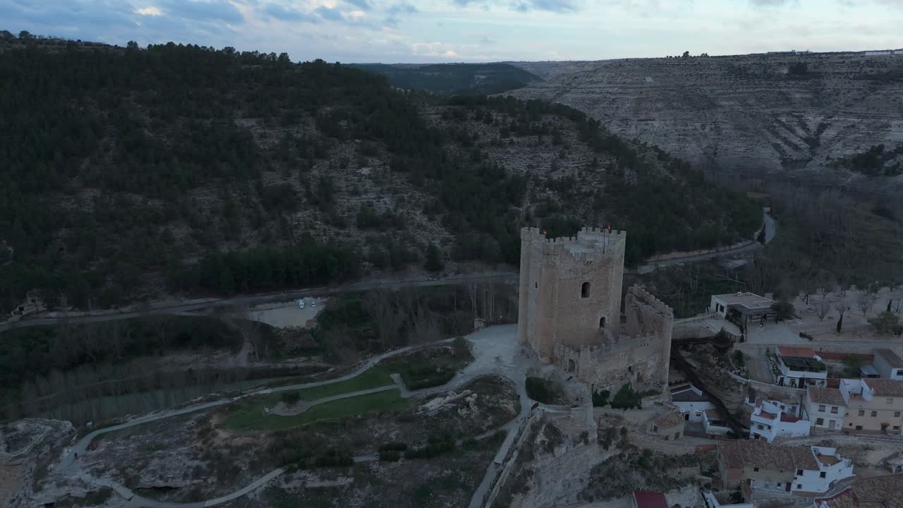 Moving forward drone movement to the castle of the medieval village of Alcal&aacute; del Jucar, Spain, one of the most beautiful villages in Spain