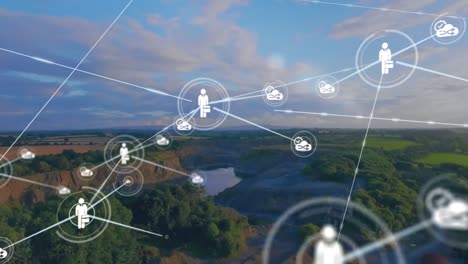 animación de iconos conectados sobre vista aérea del bosque y el lago contra un cielo nublado