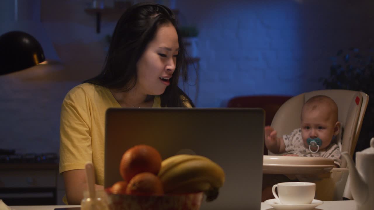 Working Mom with Baby at Night