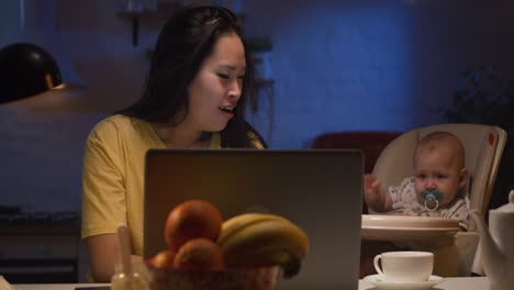 working mom with baby at night