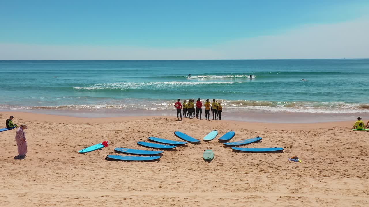 Aerial: Surf School Class On Beach In Sydney Australia. Surfboards In The Sand, Holiday Aerial Video
