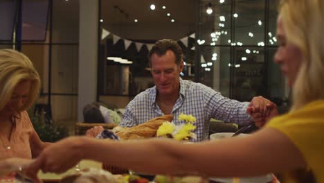 happy family praying before dinner