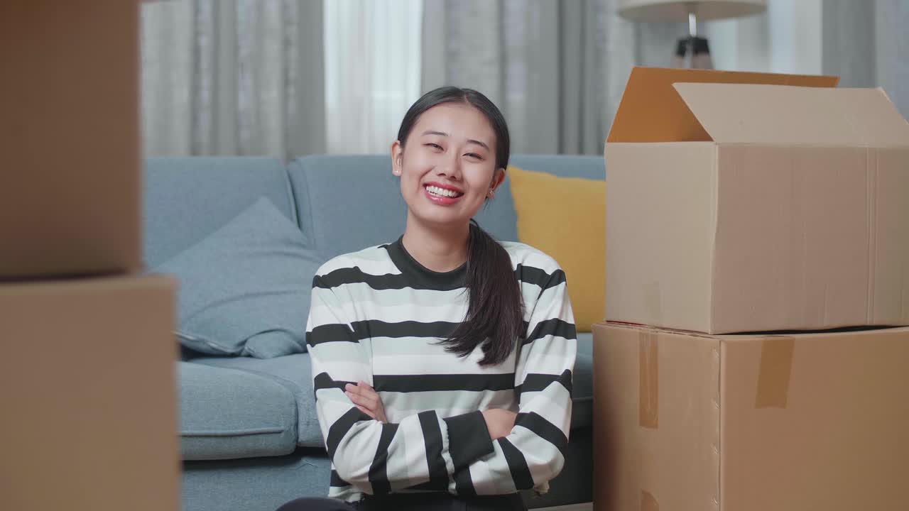Happy Woman Moving Into a New Home