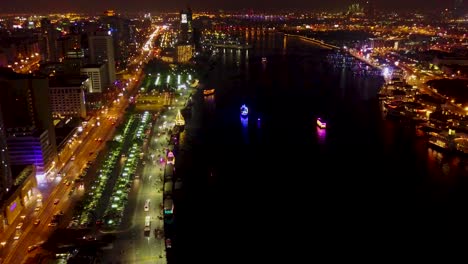 night view of dubai marina with illuminated boats