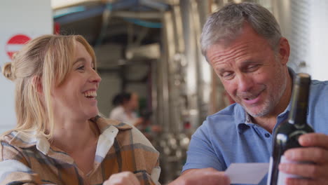 Workers-With-Laptop-Meeting-Checking-Production-Inside-Winery-With-Storage-Tanks