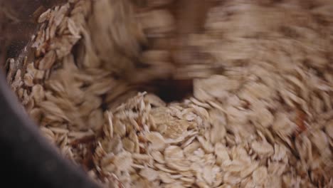 close-up view, mixing oats with chocolate batter, baking chocolate cake, delicious dessert - steady shot