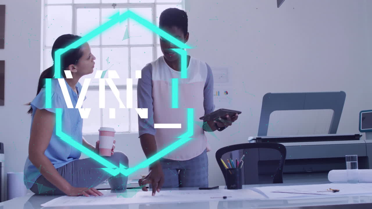 Discussing work at office desk, two people with digital animation overlay