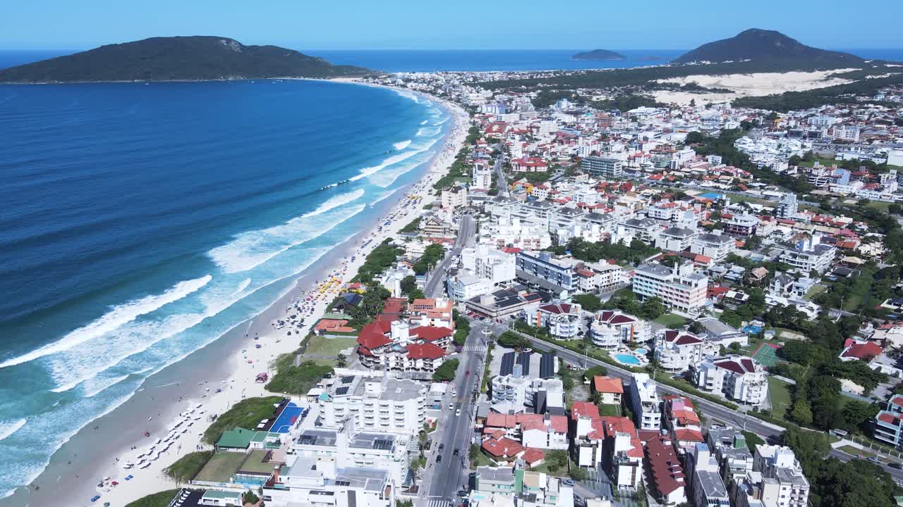 Panoramic aerial view of Ingleses beach in Florianópolis, Santa Catarina, an urban complex on the coast, city master plan, neighborhoods and real estate developments facing the sea