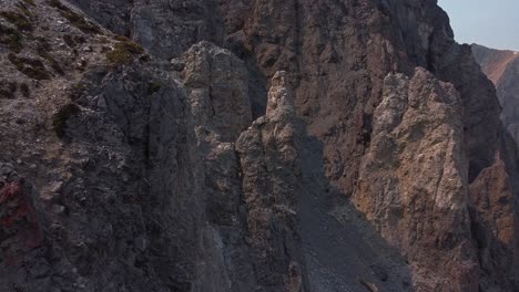 Rock-formation-in-mountain-range-with-pan-on-a-sunny-day