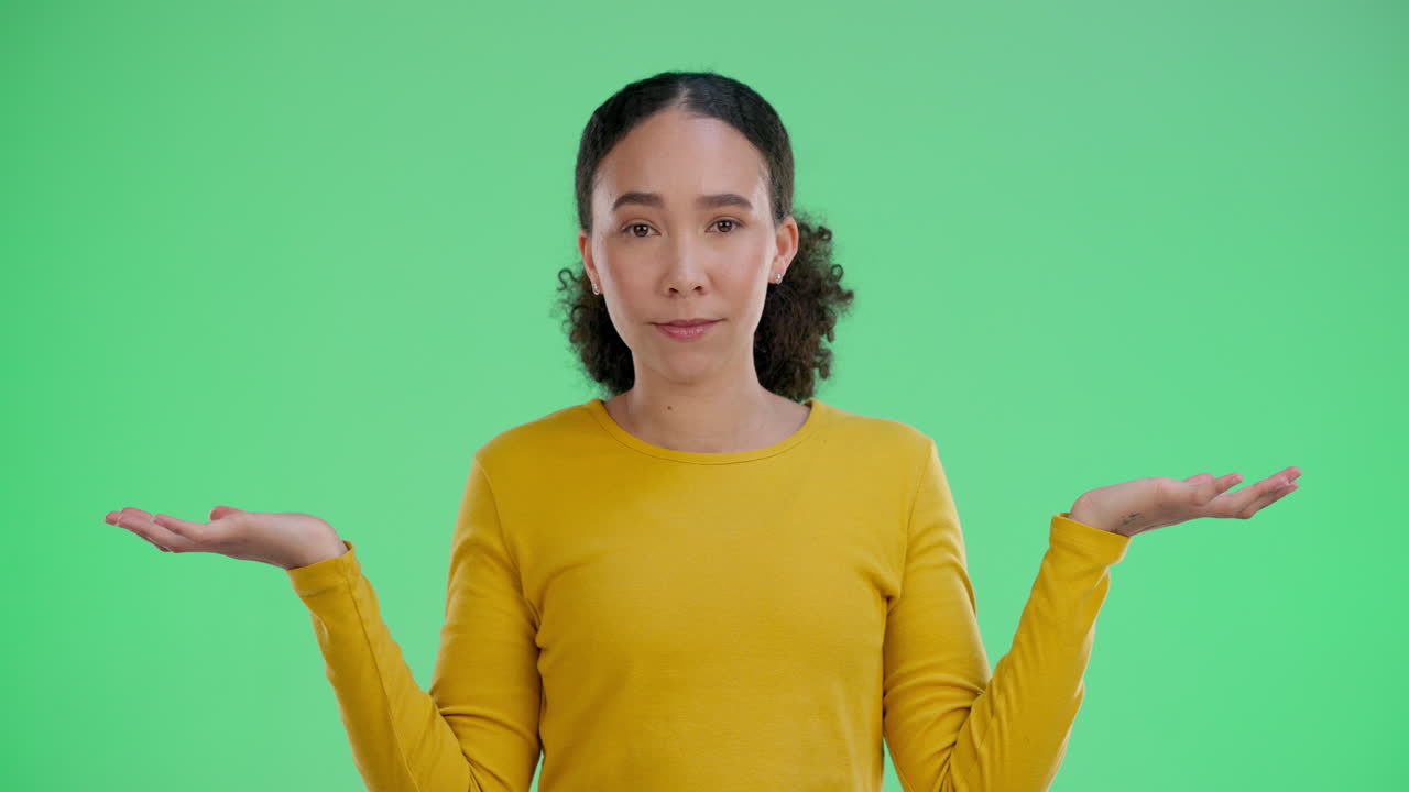 Woman shrugging on green screen