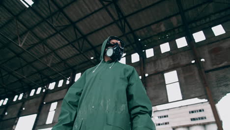 man in gas mask on ruins. man with gas mask and decontamination suit