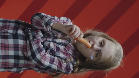 girl eating a carrot