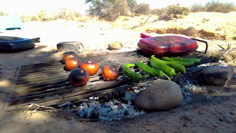 grilled lamb chops barbecued over embers in the middle of the desert in bivouac