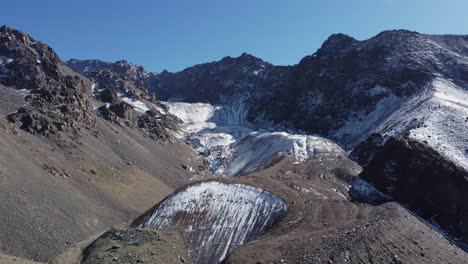 Glacial-moraine-form-gravel-hills-in-Argentina-Andes-mountains,-aerial