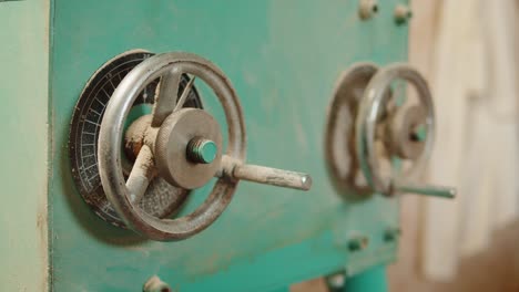 craft beer production factory, brewery manufacture. putting barley malt grains in conveyor close-up. brewing, cooking alcohol in metal vats bottles