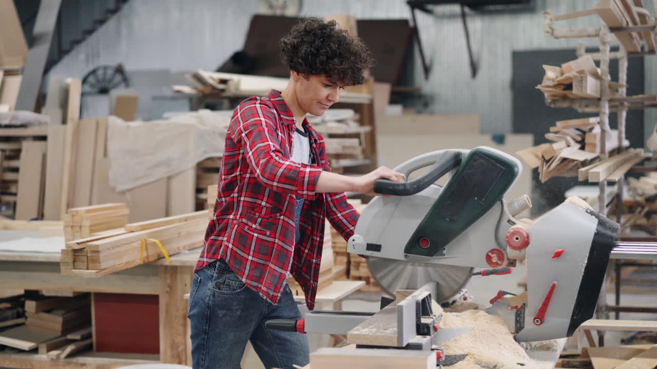 Woman Working with Circular Saw in a Workshop