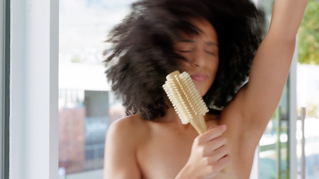 Dance, hair care and black woman with brush