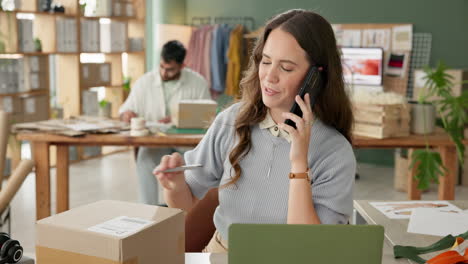 woman on phone in office with packages