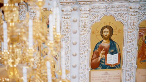 orthodox church interior with icons and candles