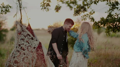 young attractive couple embracing and smiling while on camp 1