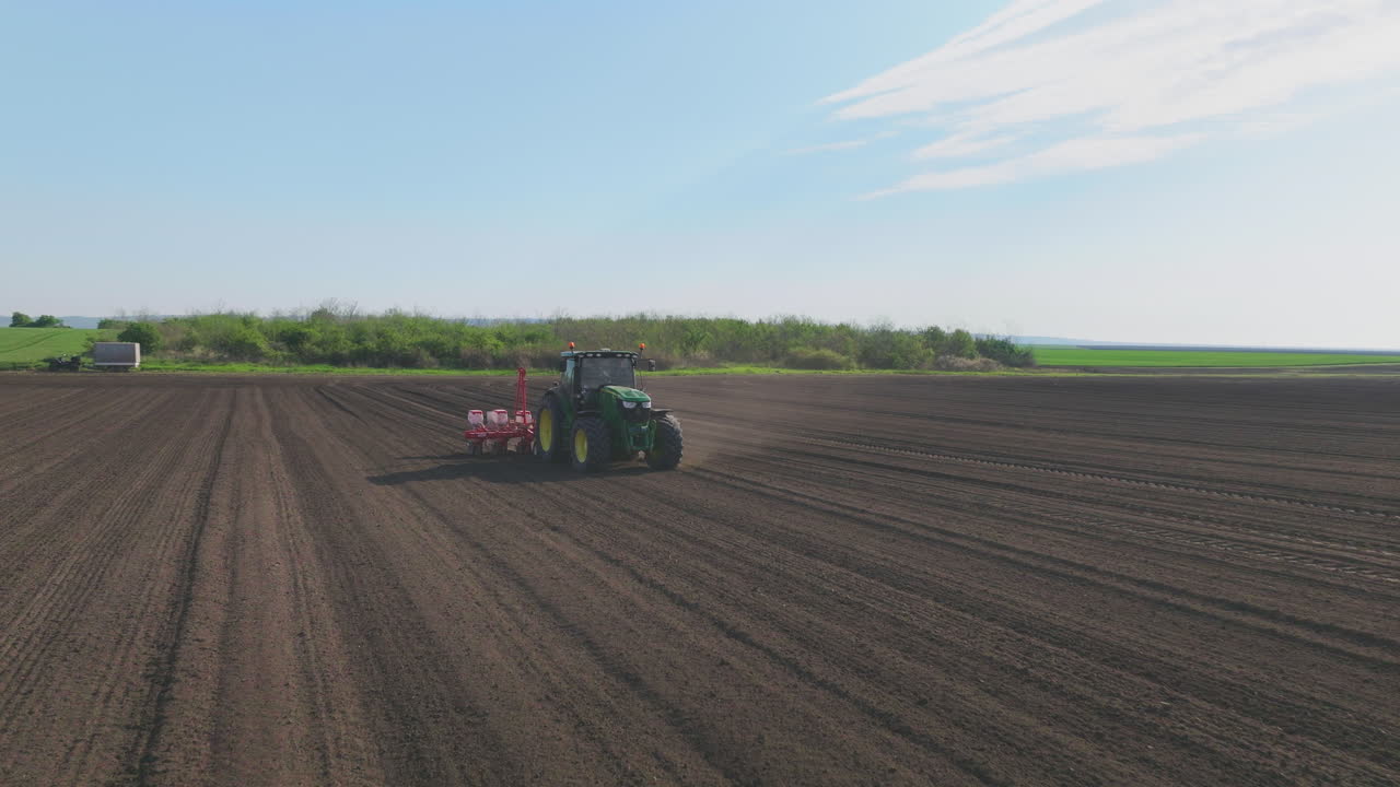 Tractor Planting Seeds in Field