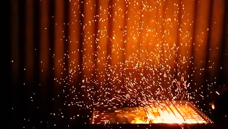 Super-slow-motion-shot-of-a-barbecue-being-prepared-with-the-help-of-a-wind-blower-in-Vagamon,-Kerala,-India-captured-in-240fps-and-converted-to-30fps