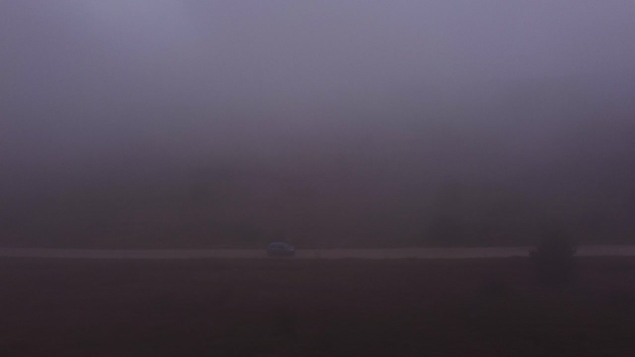 Just one car driving in the dangerous scene