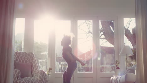 happy-little-boy-jumping-off-sofa-having-fun-playing-game-of-pretend-child-in-playful-mood-enjoying-weekend-morning-at-home-with-sunlight-shining-through-window-childhood-imagination-4k-footage