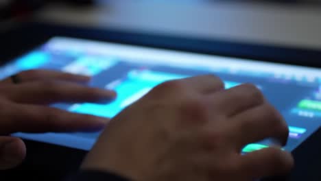 engaging in digital interaction: close-up of hands using touchscreen technology for creative or gaming activities