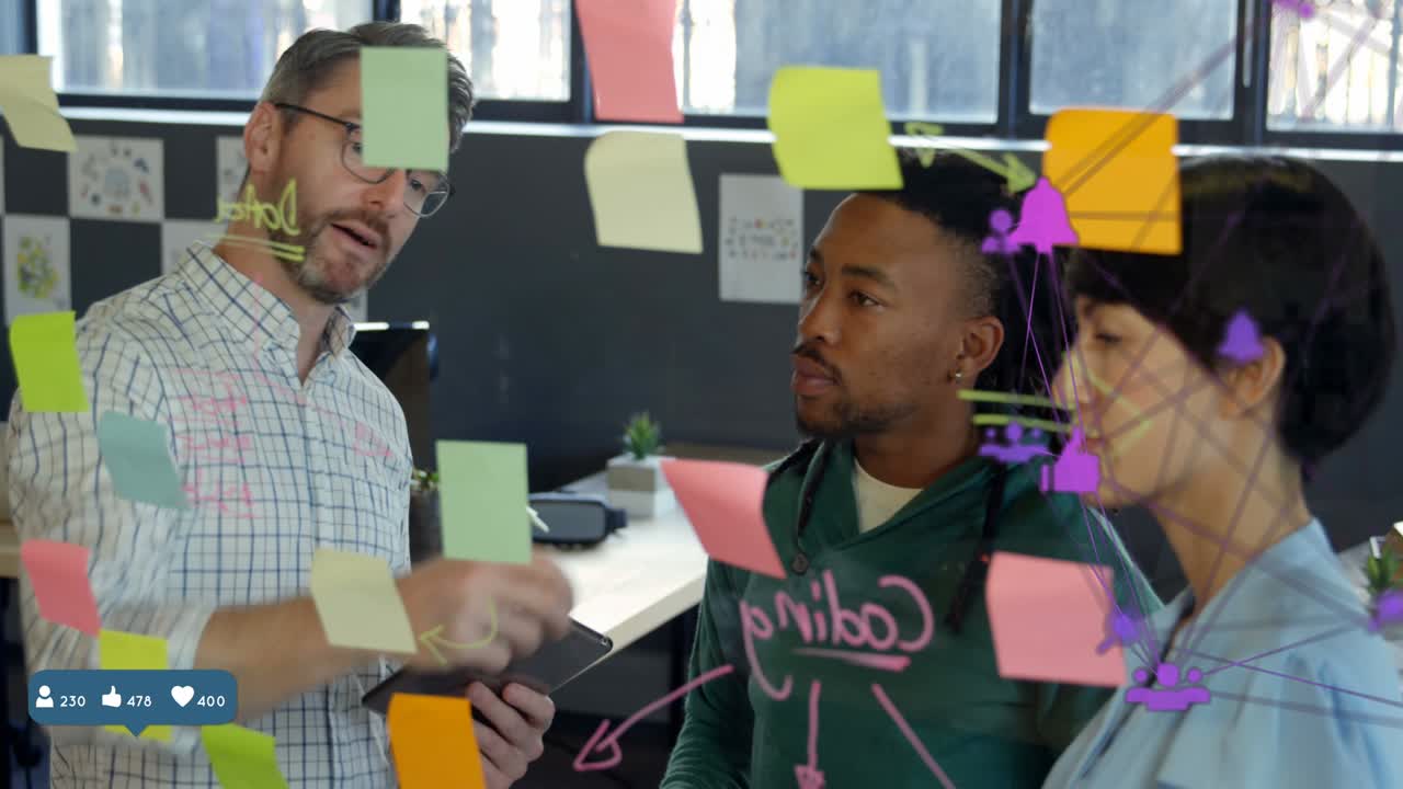 Globe of digital icons against office colleagues discussing over memo notes at office