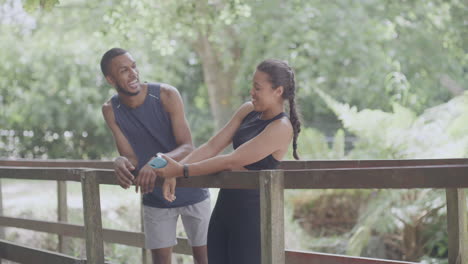 laughing athletes using phone to take a selfie