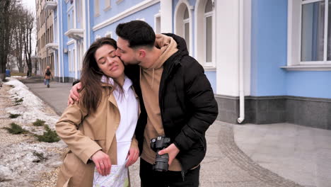 caucasian tourist couple walking through the city.