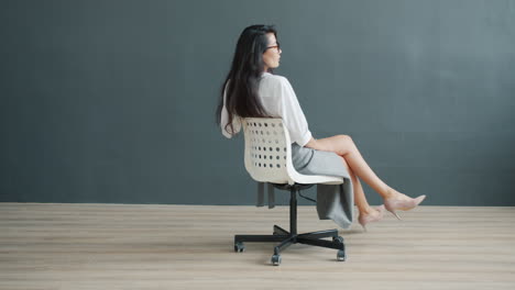 woman sitting in an office chair