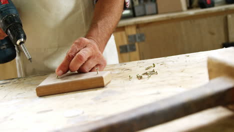 carpenter working with drill